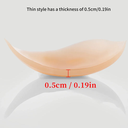 Invisible, strapless self-adhesive bra with transparent front clasp